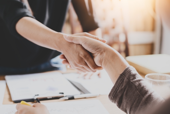 AD Body Corporate employee shaking the hand of property manager