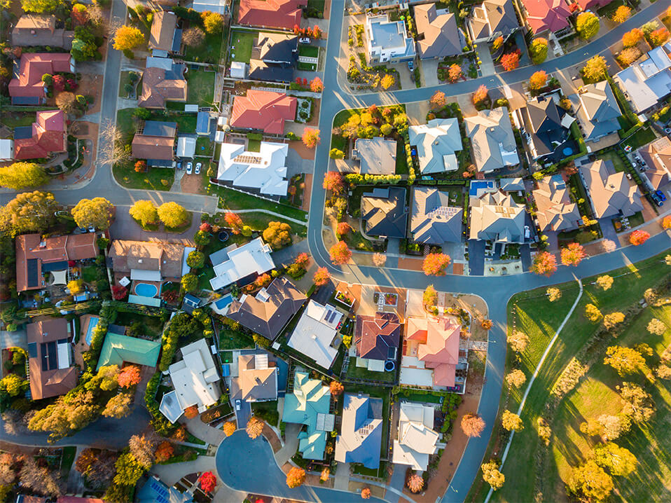 aerial view of a neighbourhood in autumn with orange trees